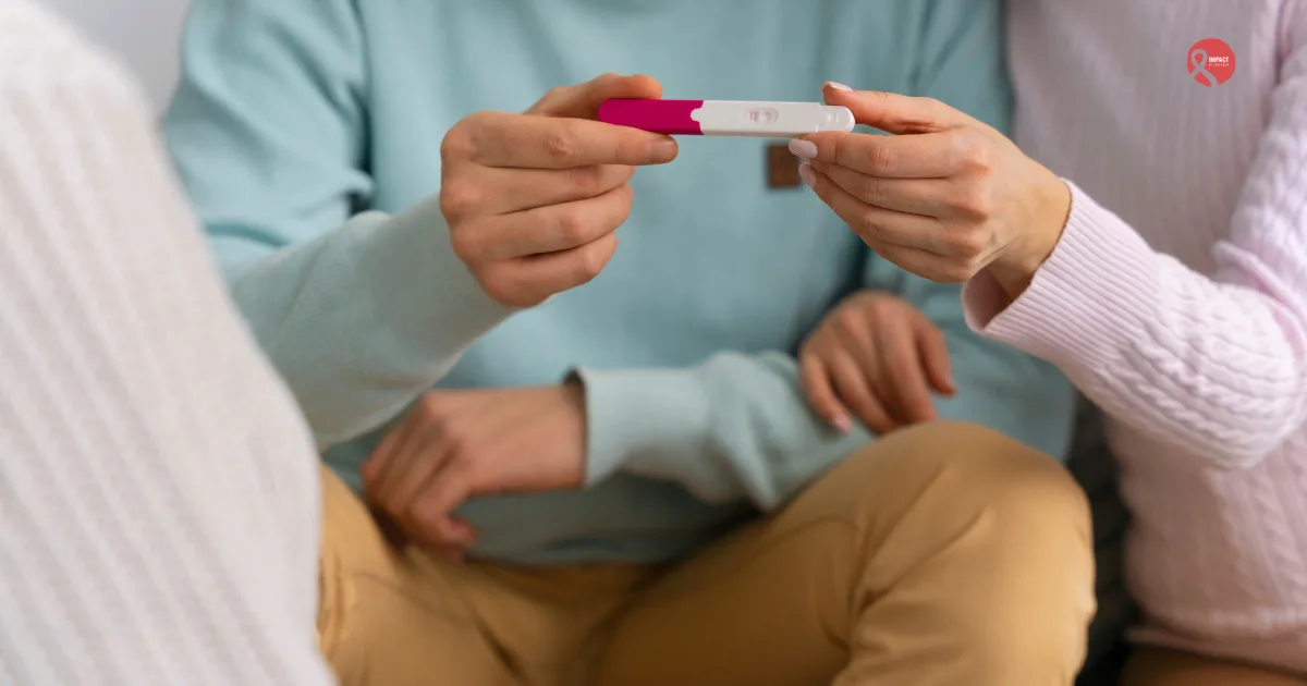 Couple holding a pregnancy test, symbolizing fertility considerations before cancer treatment