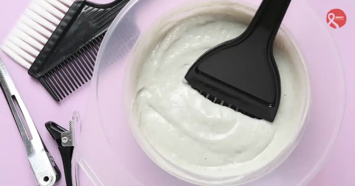 Hair dye mixture with brush and salon tools representing concerns about Hair Dyes and Cancer risk.